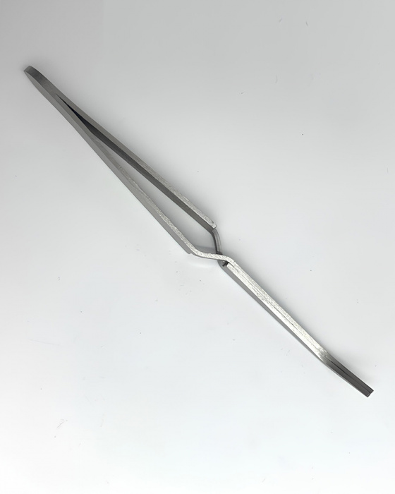 Зворотний пінцет для затиску арки